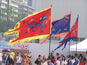 Bright banners being carried at traditional changing of palace guard