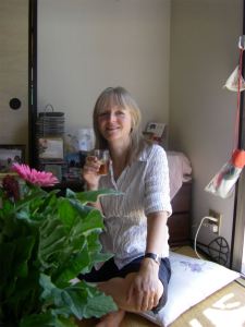 Ruth crosslegged on a cushion 