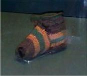 Sock with purple orange and green stripes