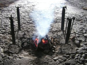 Wood fire in middle of chalk floor