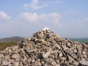 View of horse's skull on hilltop mound of stones