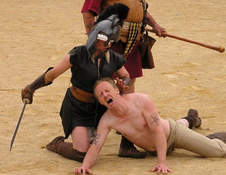 Gladiatrix defeating condemned prisoner