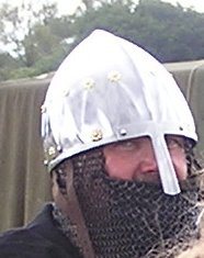 Man in chainmail and silver helmet with nose protector