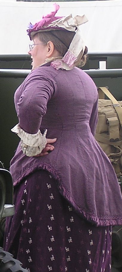 Victorian lady in mauve velvet jacket fancy hat